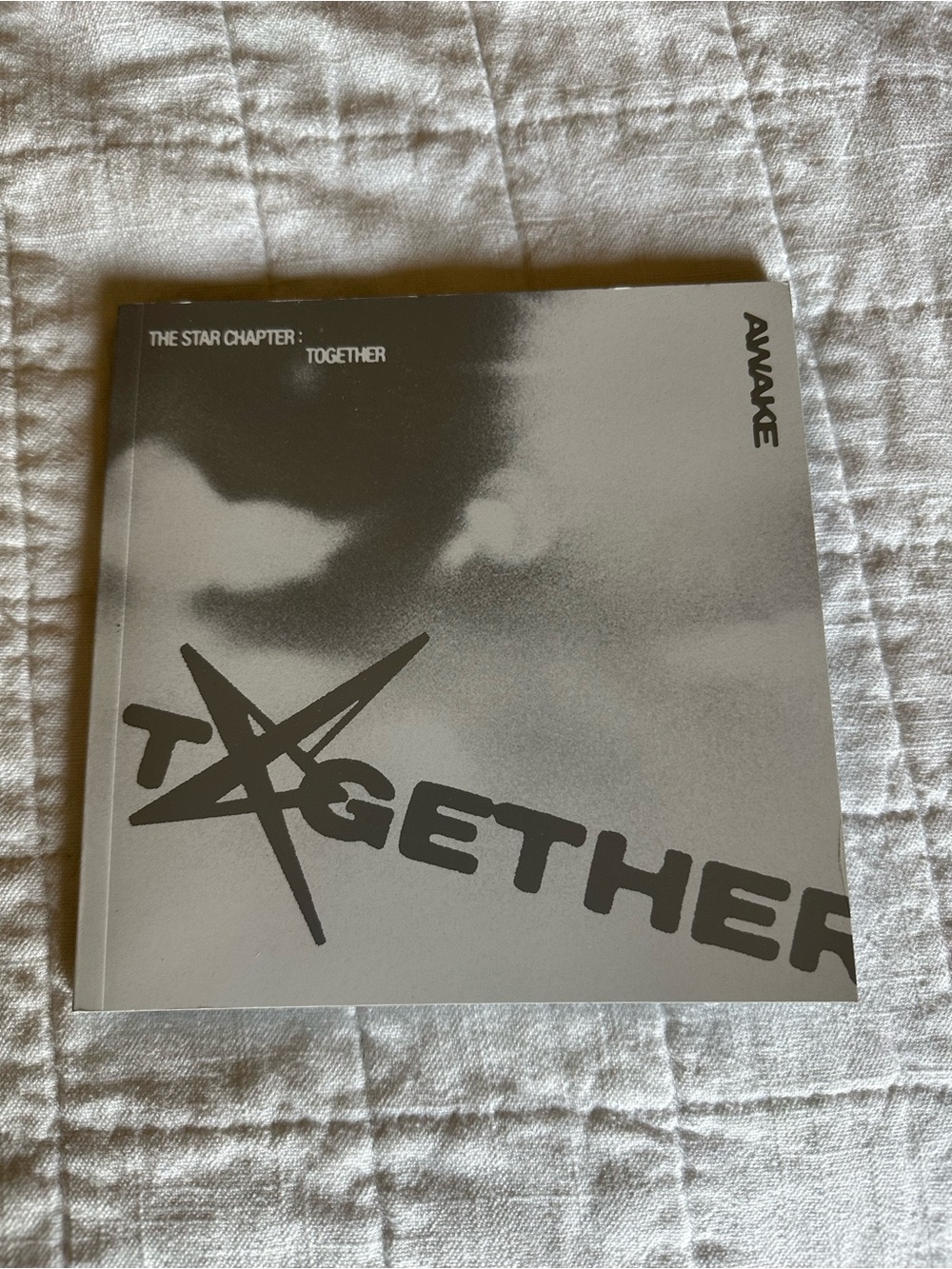 Awake version of TOMORROW X TOGETHER's, The Star Chapter: Together. Photo book